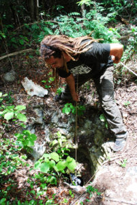 Alvaro lowering tanks into a Cenote